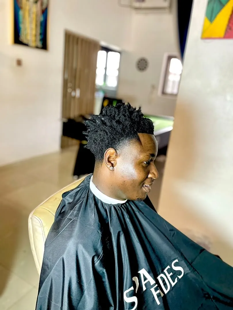 In-home barbering session by SPA_Fades mobile barber, clean fade finish